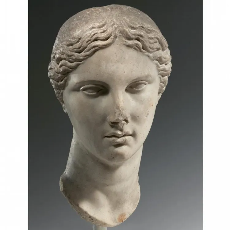 a greek marble head of a goddess